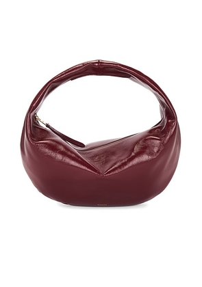 KHAITE Olivia Patent Hobo Bag in Oxblood - Wine. Size all.