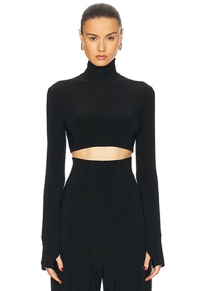 Norma Kamali Cropped Slim Fit Long Sleeve Turtleneck Top in Black - Black. Size M (also in L, S, XL, XS).