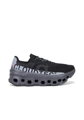 On Cloudmonster Lumos Sneaker in Black - Black. Size 5 (also in 10, 5.5, 6, 6.5, 7, 7.5, 8, 8.5, 9, 9.5).