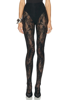 Norma Kamali Footie Legging in Black - Black. Size S (also in L, XS).