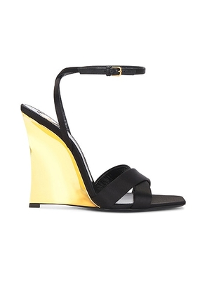 Saint Laurent Lydia Wedge Sandal in Nero - Black. Size 36.5 (also in 36, 37, 37.5, 38, 38.5, 39, 39.5, 40, 41).