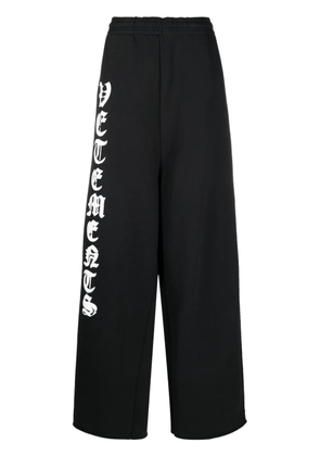 VETEMENTS logo-print wide-leg track pants - Black