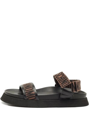 Moschino Pre-Owned logo-embellishment sandals - Black