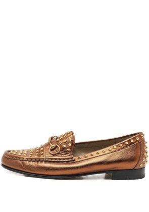 Gucci Pre-Owned spike-embellished leather loafers - Gold