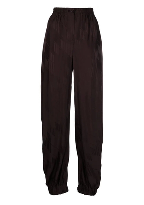 The Attico logo-jacquard tapered trousers - Brown