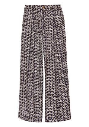 AERON Wellen monogram-print trousers - Black