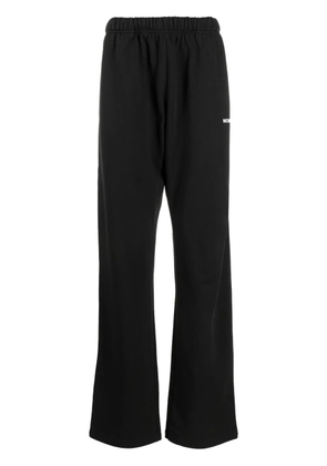We11done logo-print track pants - Black