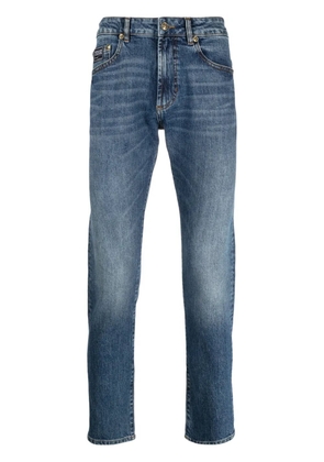 Versace Jeans Couture logo-appliqué slim-cut jeans - Blue