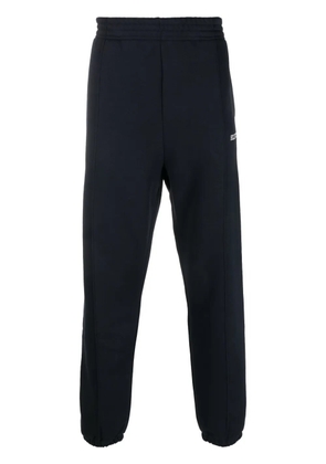 Tommy Hilfiger Monotype logo-embroidered track pants - Blue