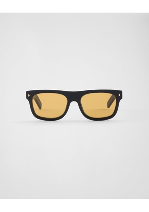 Sunglasses with the iconic metal plaque