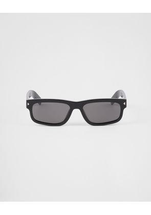 Sunglasses with the iconic metal plaque