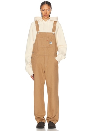 Carhartt WIP Bib Overall in Peanut Rinsed - Brown. Size XS (also in ).