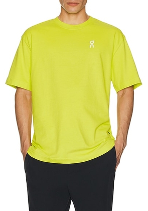 On Club T in Lime - Yellow. Size L (also in XL/1X).