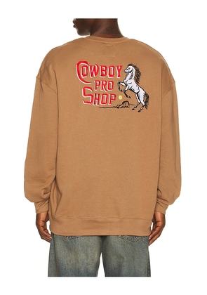 Sendero Provisions Co. Cowboy Pro Shop Sweatshirt in Brown. Size L. Also in M, S, XL/1X, XS.