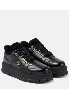 Prada Shearling-lined leather platform sneakers