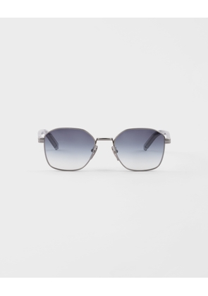 Sunglasses with the iconic metal plaque