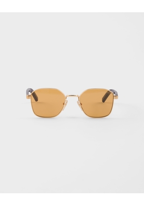 Sunglasses with the iconic metal plaque