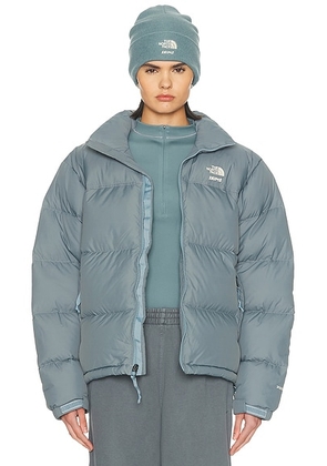 The North Face x SKIMS 1996 Nuptse Jacket in SK Kyanite - Teal. Size L (also in M, S, XL, XS, XXL).