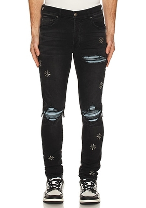 Amiri Stud MX1 Jean in Vintage Black - Black. Size 31 (also in 30, 32, 33, 34, 36, 38).