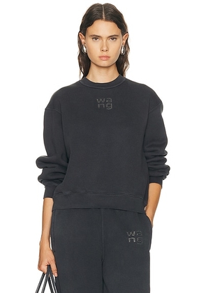 Alexander Wang Hotfix Logo Crewneck Sweatshirt in Washed Black - Black. Size L (also in M, S, XS).