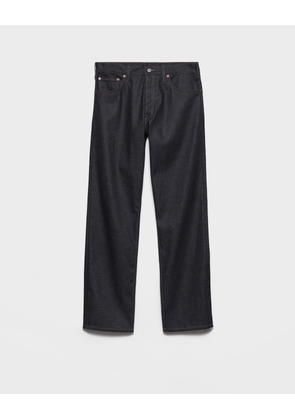 Raw denim jeans with leather strap