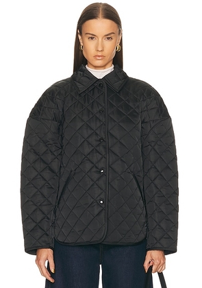 Toteme Collared Quilted Jacket in Black - Black. Size 36 (also in ).