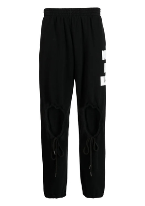 Natasha Zinko heart-shaped cut-out detail track pants - Black