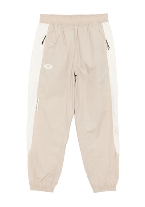 AAPE BY *A BATHING APE® logo-embroidered trousers - Neutrals