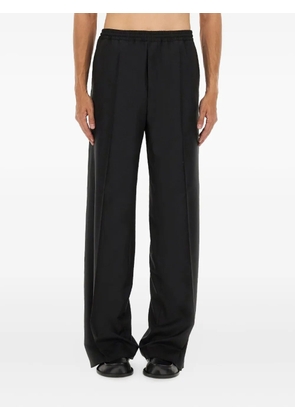 Moschino button-embellishment trousers - Black