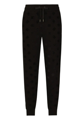 Dolce & Gabbana monogram-embossed cotton track pants - Black