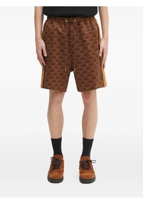A BATHING APE® printed side-stripe shorts - Brown