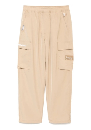 AAPE BY *A BATHING APE® moonface-logo cargo trousers - Neutrals