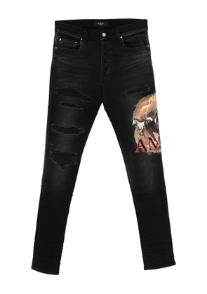 AMIRI ripped graphic jeans - Black