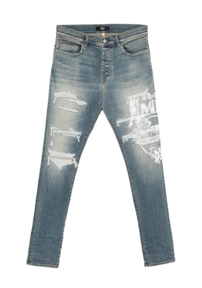 AMIRI ripped print jeans - Blue