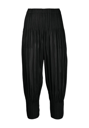 Pleats Please Issey Miyake pleated-panel trousers - Black
