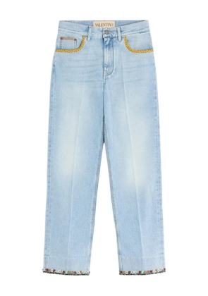 Valentino Garavani floral-hem faded jeans - Blue