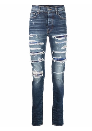 AMIRI distressed slim-fit jeans - Blue