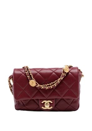 CHANEL Pre-Owned 2021-2025 Mini Quilted Caviar Twist Your Buttons Flap crossbody bag - Red