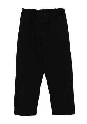Black Comme Des Garçons garment treated trousers