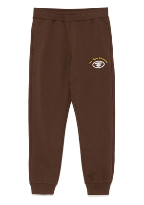 AAPE BY *A BATHING APE® logo-patch track pants - Brown