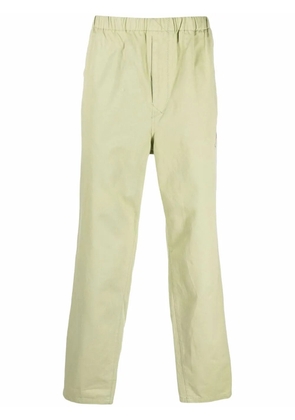 Undercover logo-patch trousers - Green