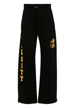 AMIRI flocked-logo cotton track pants - Black