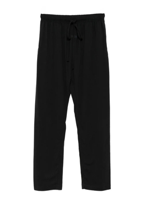FEAR OF GOD ESSENTIALS logo-patch trousers - Black