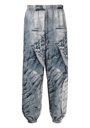 Natasha Zinko denim-print track pants - Blue