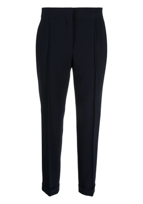 Moschino pressed-crease concealed-fastening tapered trousers - Blue