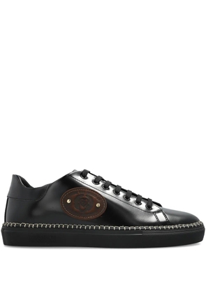 Moschino logo-embossed trainers - Black