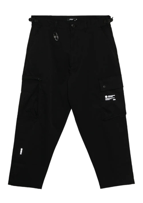izzue logo-patched trousers - Black