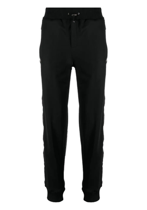 Philipp Plein engraved-buttons drawstring track pants - Black