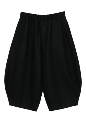 Black Comme Des Garçons elasticated trousers
