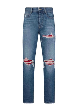 AMIRI distressed ripped-knees denim jeans - Blue